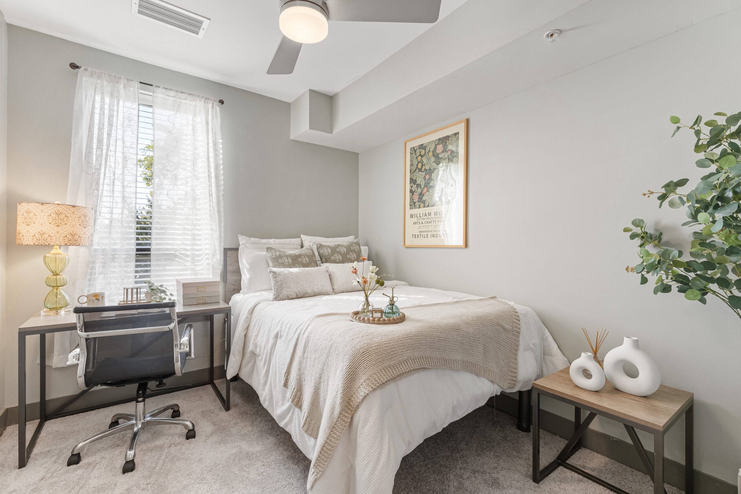 Clean and airy bedroom with warm decorative style